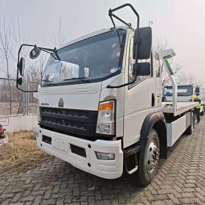 Two HOWO Wrecker Trucks Arrive at China Port Awaiting Shipment to Congo-Brazzaville